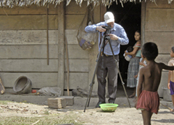 Nicholas Hellmuth photographing in Chisec, Guatemala